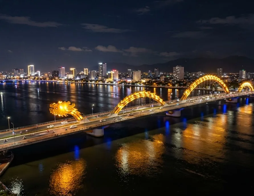 Golden dragon-shaped bridge lit up over the river at night