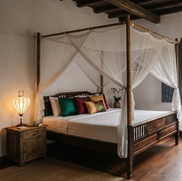 Old town guesthouse room with a four-poster bed, mosquito net and silk lantern lamp