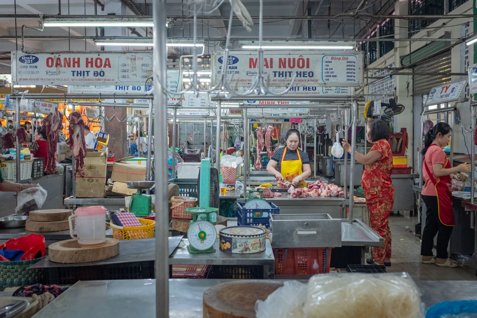 Butcher stalls and vendors at a fresh food market in Da Nang