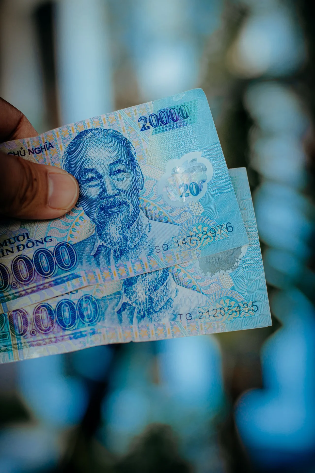 Vietnamese 20,000 dong banknotes held in hand