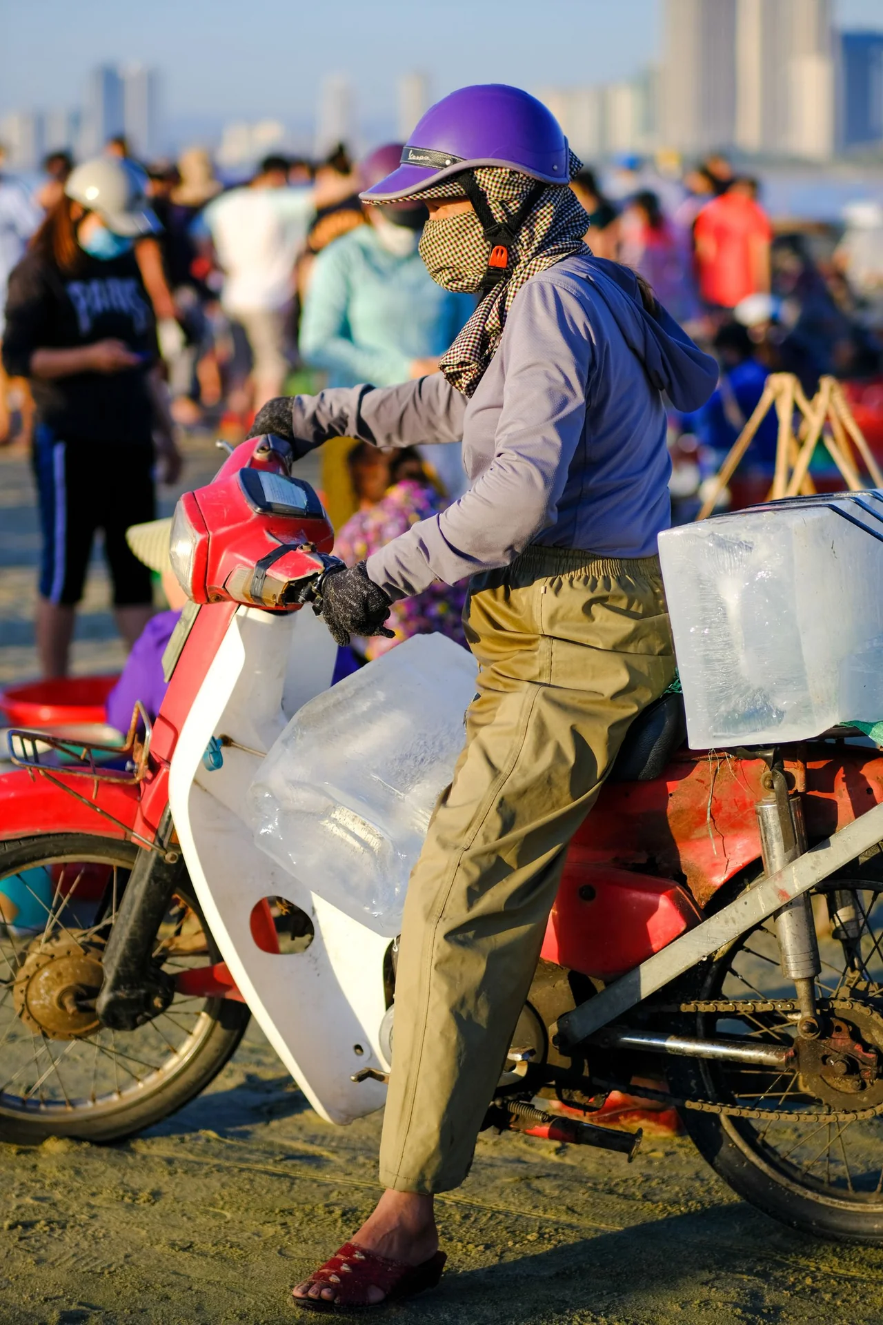 Street vendor on a motorbike at a beach market in Da Nang