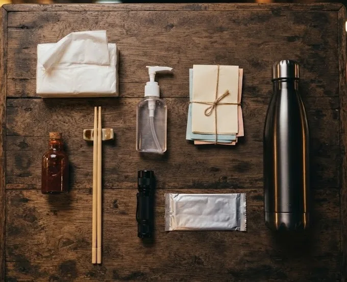 Tissues, hand sanitizer, cash, chopsticks, flashlight, wet wipes and a water bottle